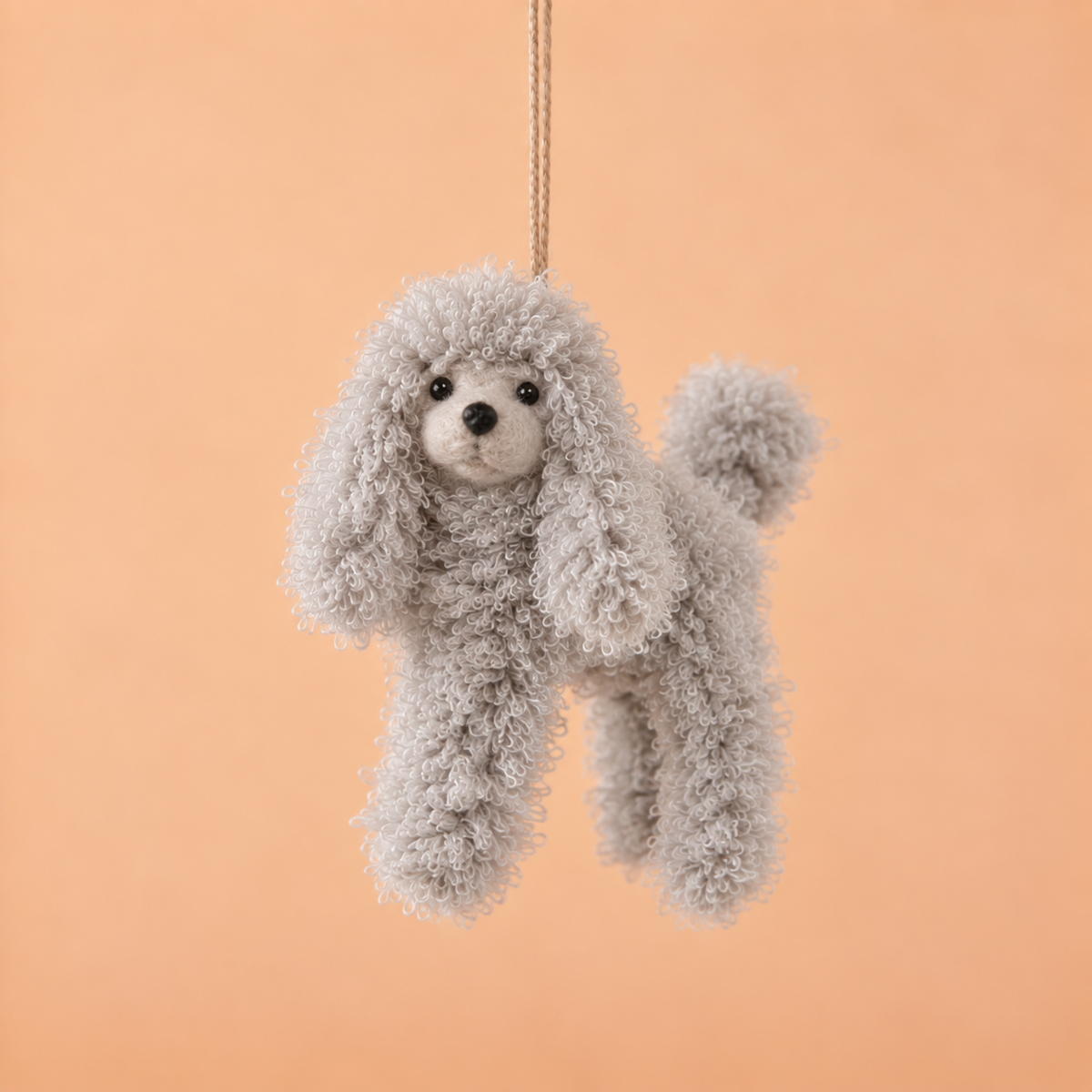 a grey poodle shaped ornament. 