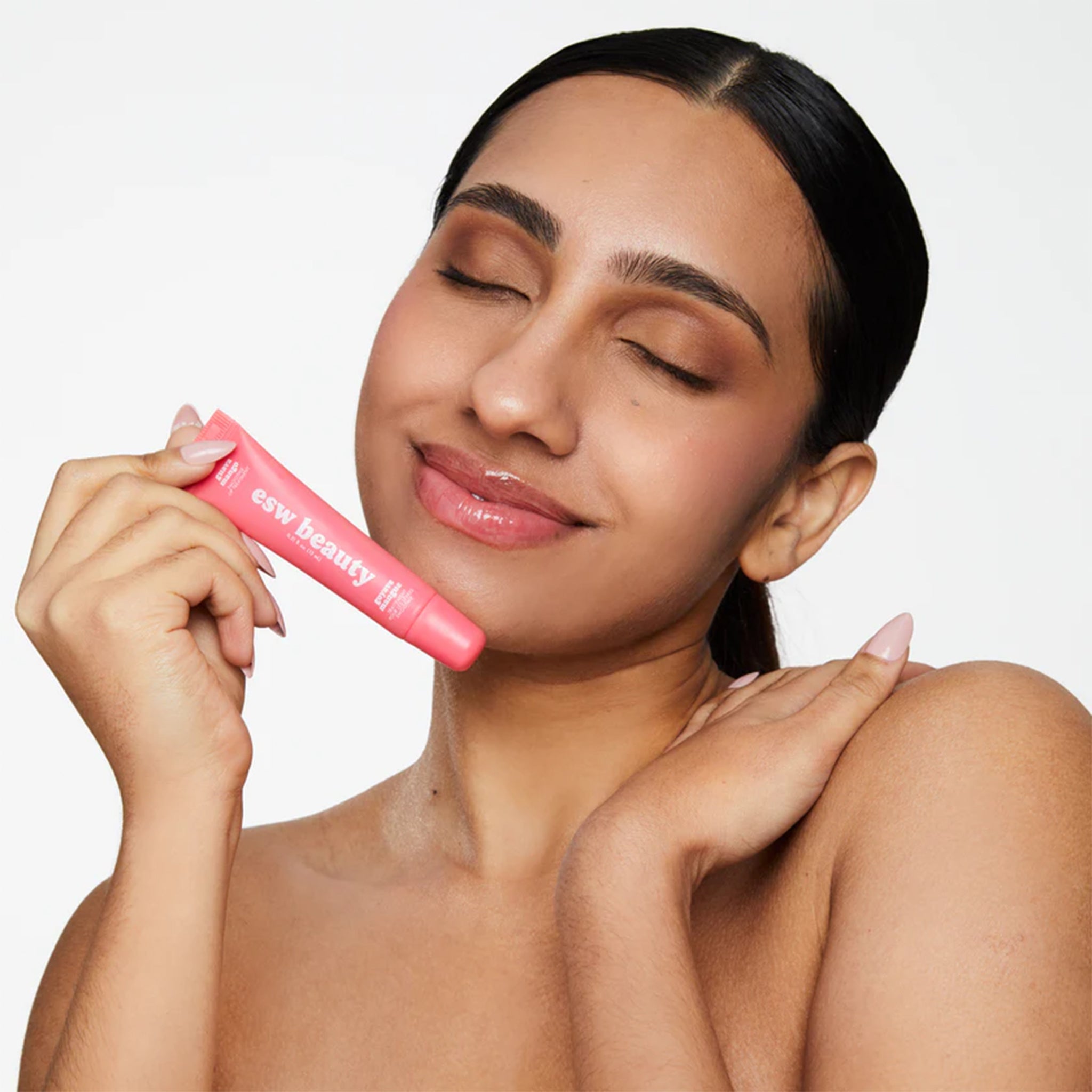 A light pink tube of guava mango lip treatment. 