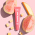 A light pink tube of guava mango lip treatment. 