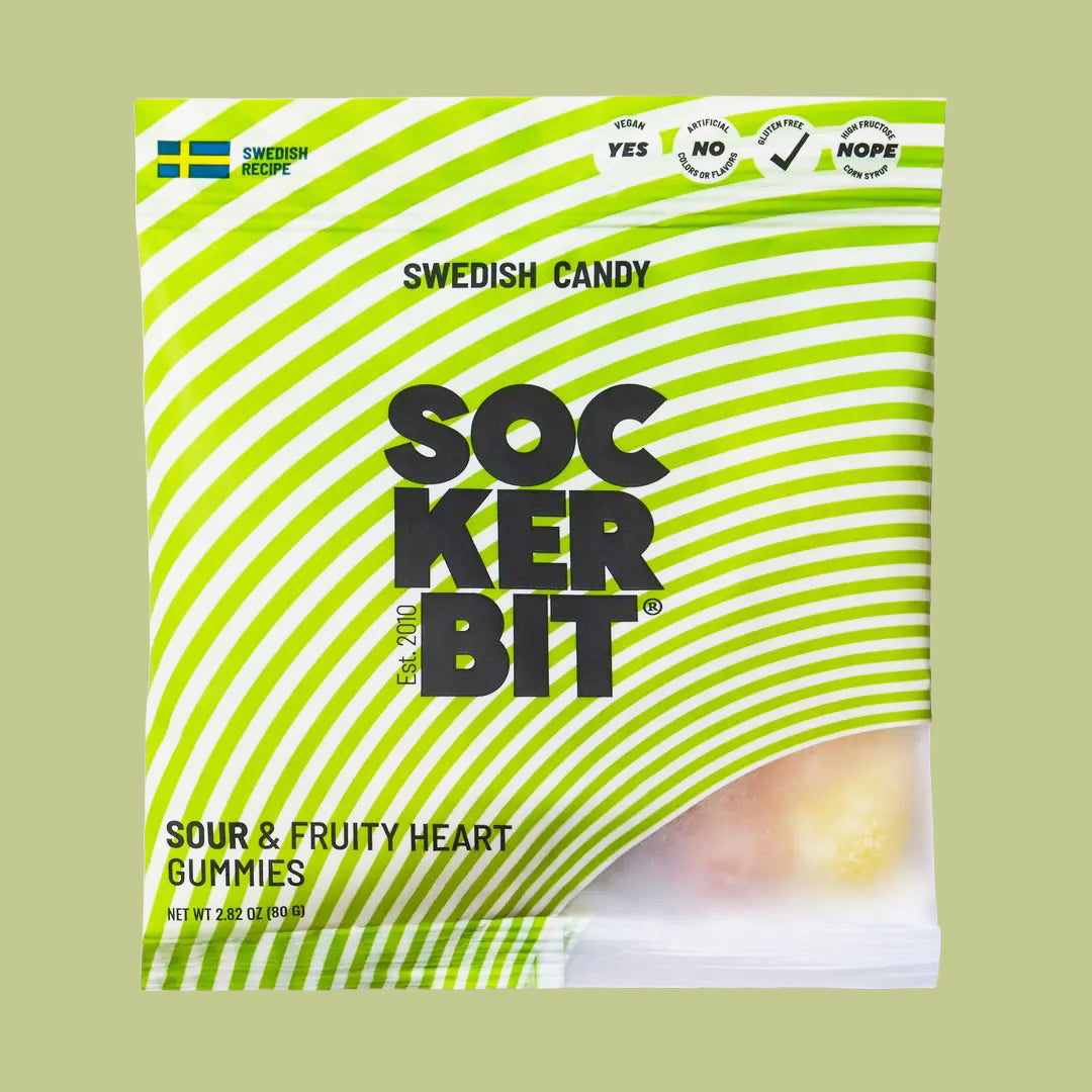 Bag of Sockerbit Swedish Candy ‘Sour & Fruity Heart Gummies" with pink striped packaging and candy visible inside.