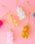 A variety of gummy bear shaped ornaments in different colors. 