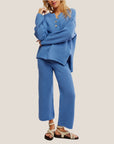 A waffle knitted blue set with a quarter button neckline and a subtly cropped pant. 