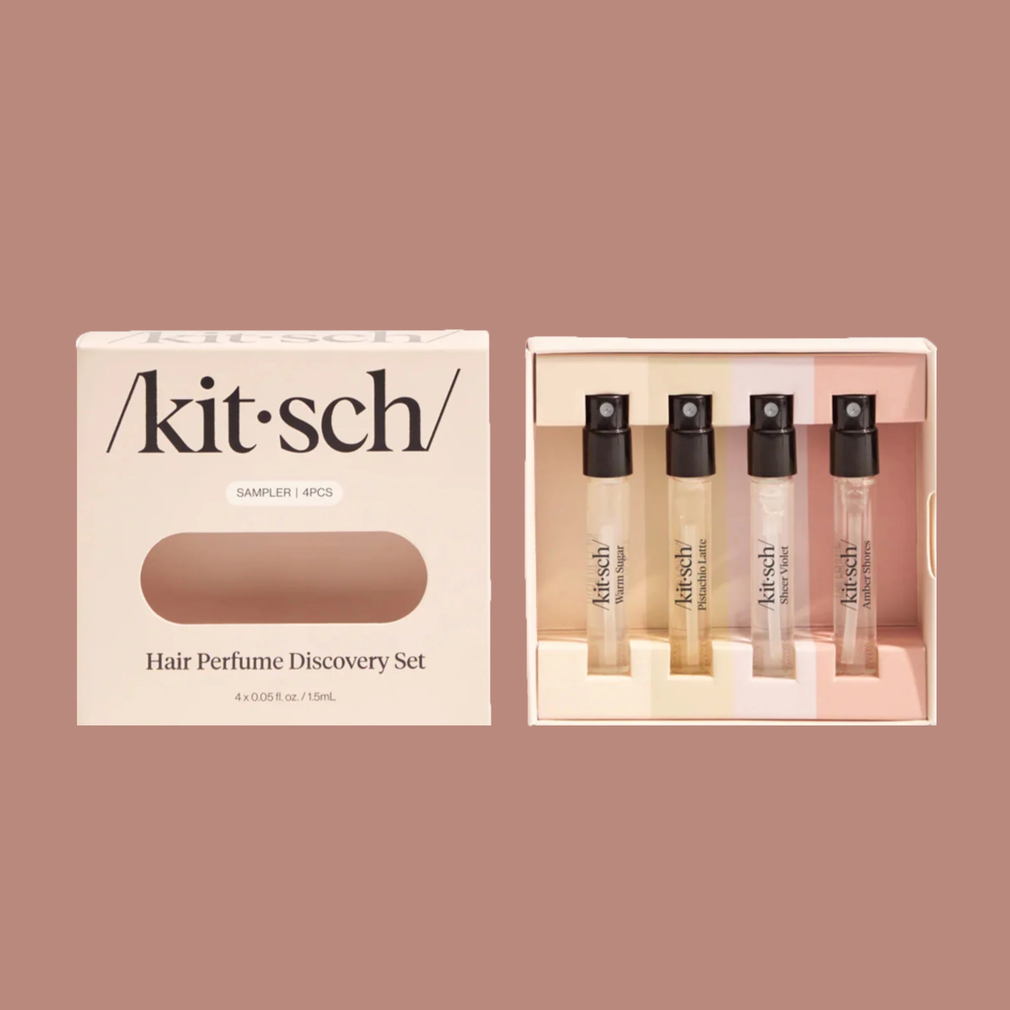 A set of four mini hair perfume testers in a light pink box. 