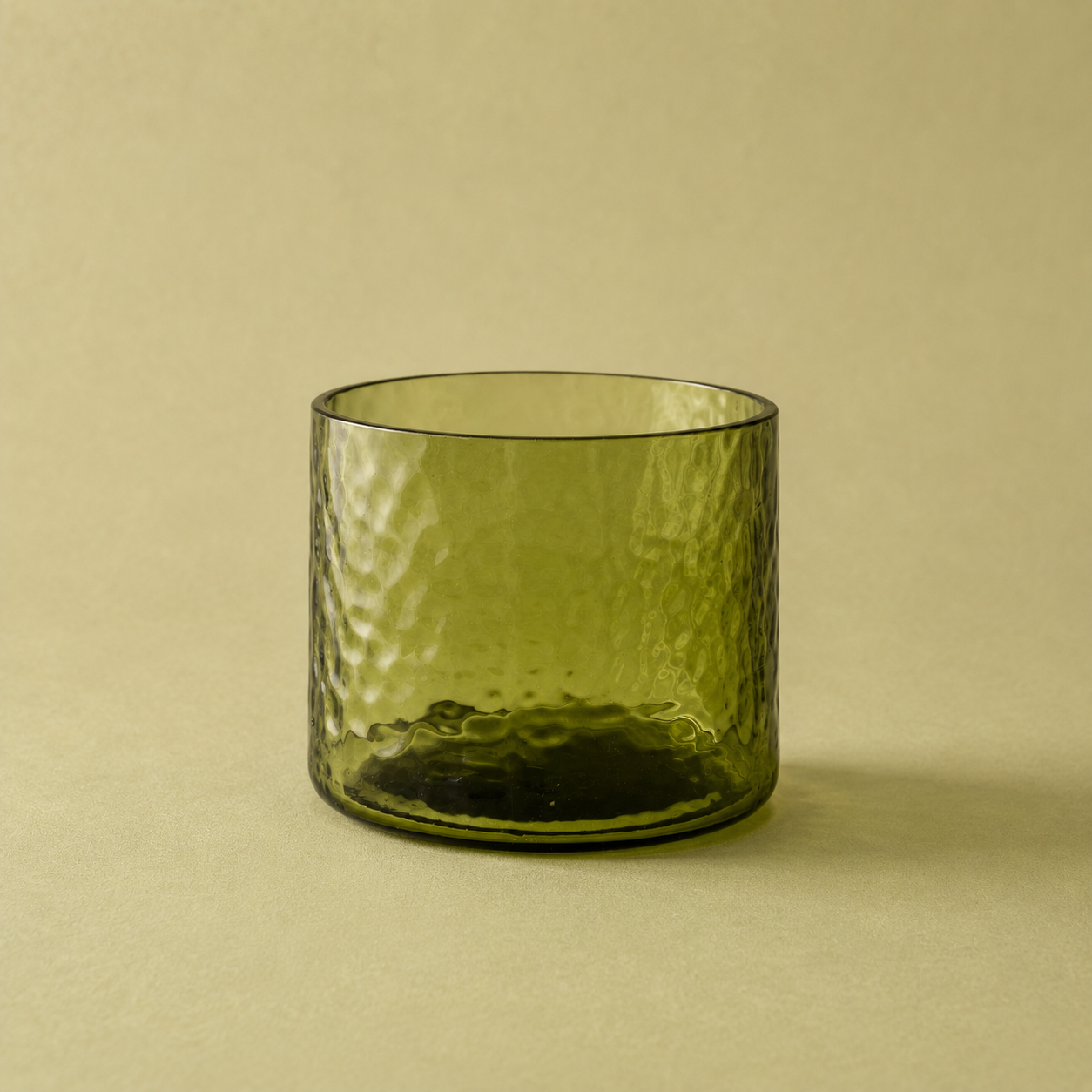 a green drinking glass 