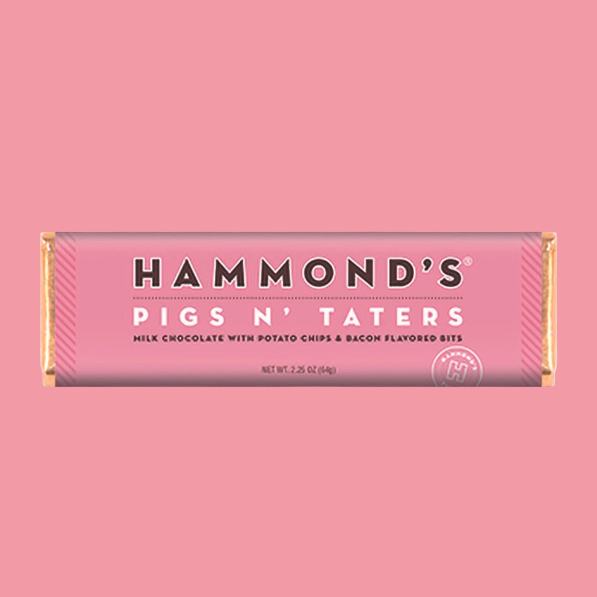 A pink bar of milk chocolate with text that reads, 'Hammond's Pigs N' Taters Milk Chocolate With Potato Chips & Bacon Flavored Bits'.