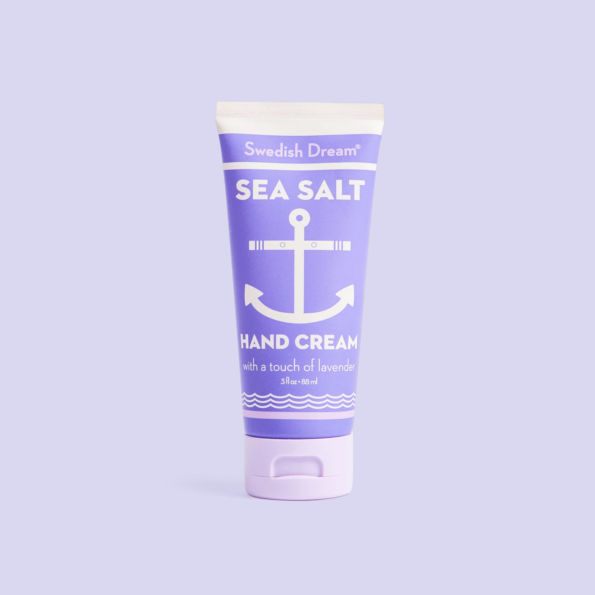 Sea salt hand cream with anchor design, shown on a soft lavender background.”