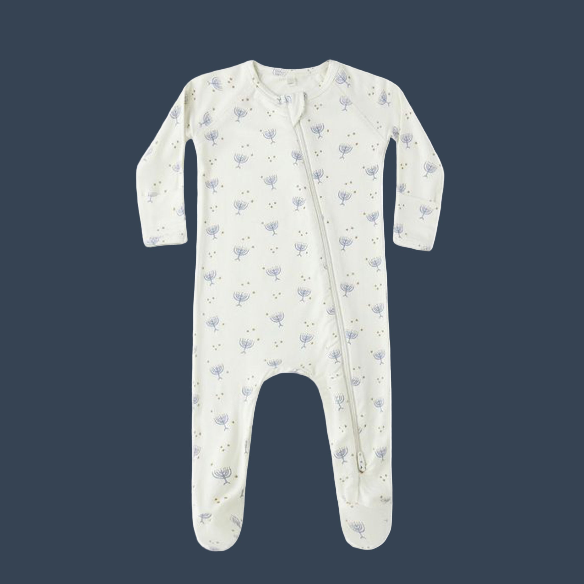 A cream colored kid onesie pajama with a menorah print. 