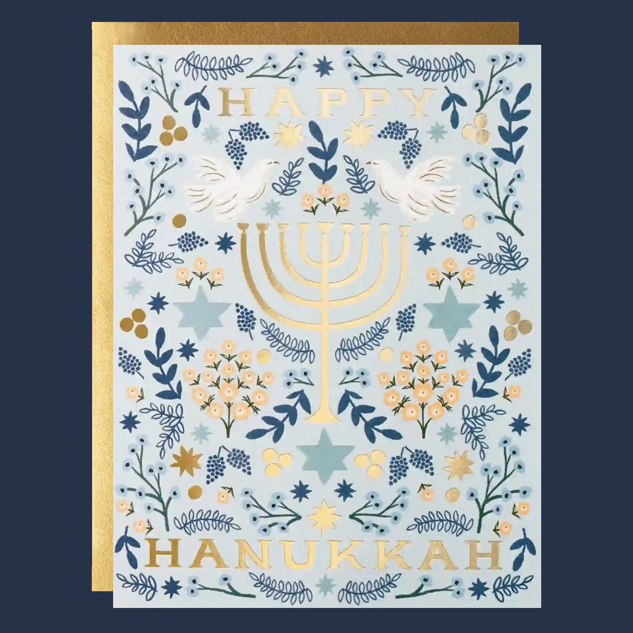 a blue and white greeting card with gold fold text that reads, "Happy Hanukkah" along with a menorah graphic. 