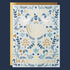 a blue and white greeting card with gold fold text that reads, "Happy Hanukkah" along with a menorah graphic. 