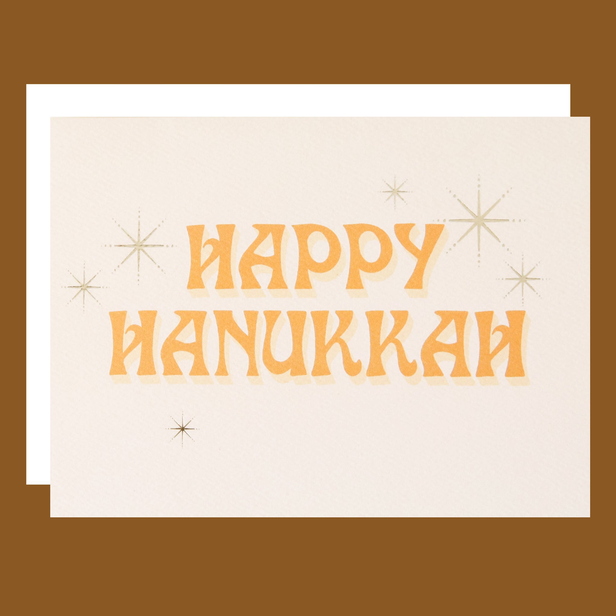 Card with 'Happy Hanukkah' text on a beige background
