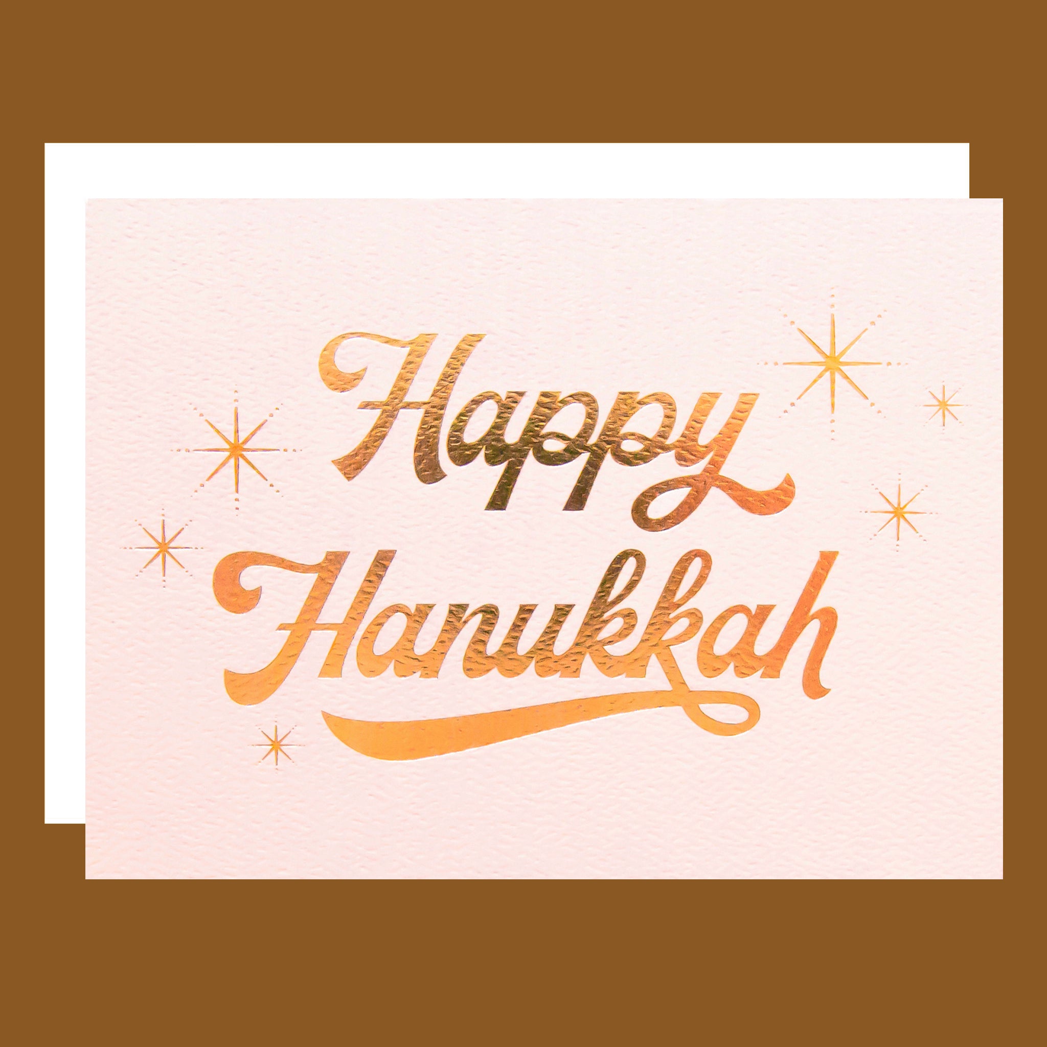 Greeting card with 'Happy Hanukkah' text on a beige background