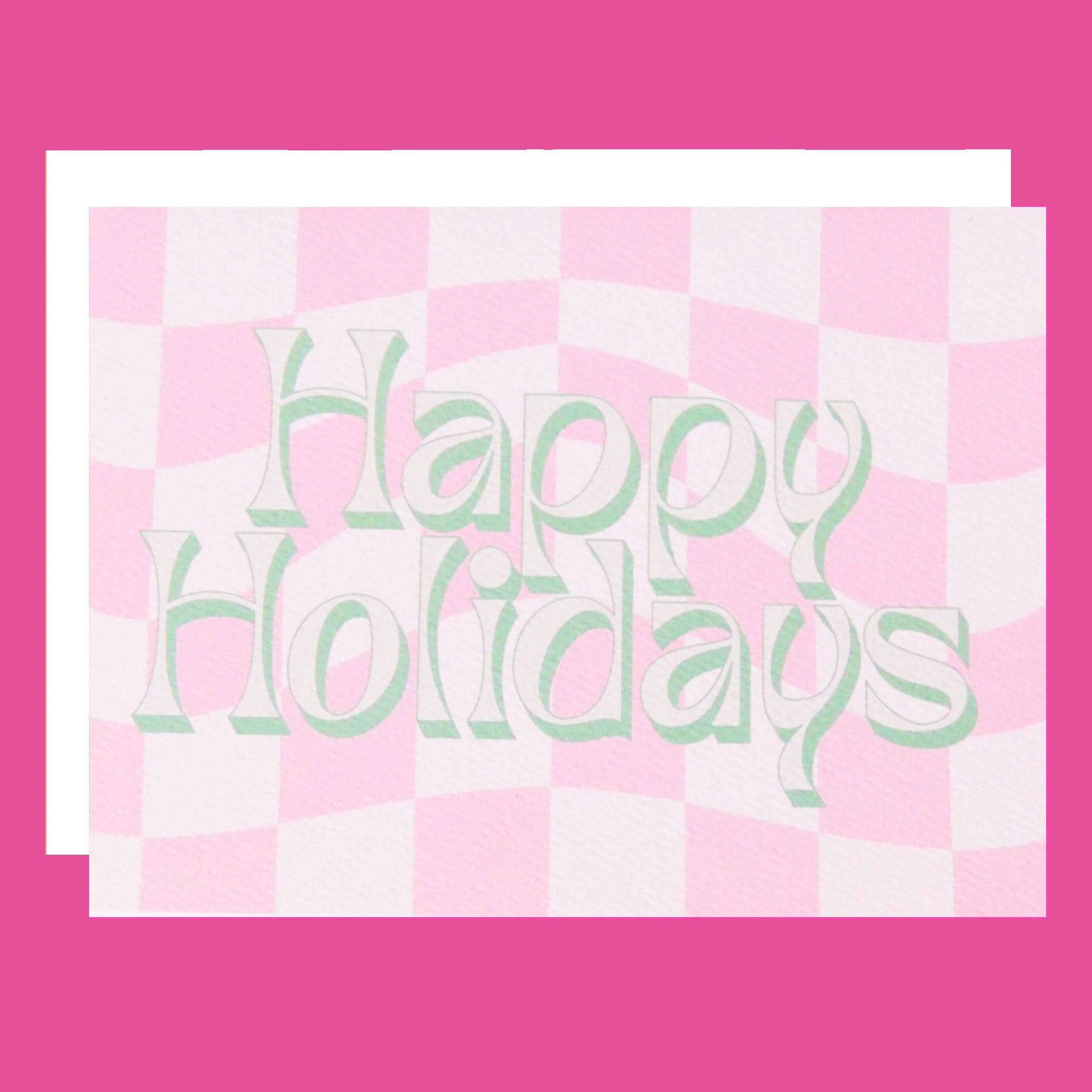 Pink and white checkered greeting card that reads 'Happy Holidays' in white font with a thin green shadow. The card is accompanied by a solid white envelope.
