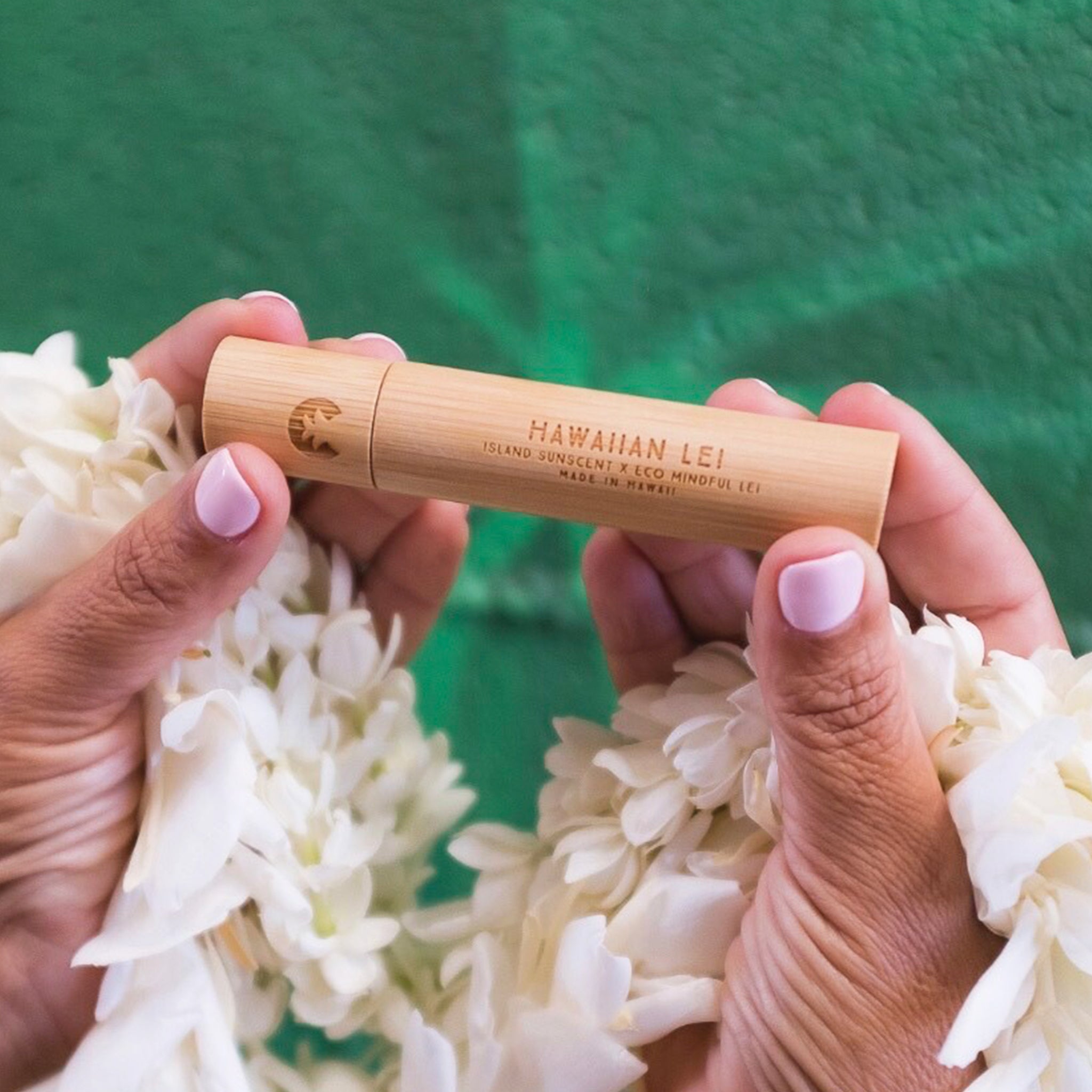 "Hawaiian Lei" on a wooden packaging travel spray perfume. 