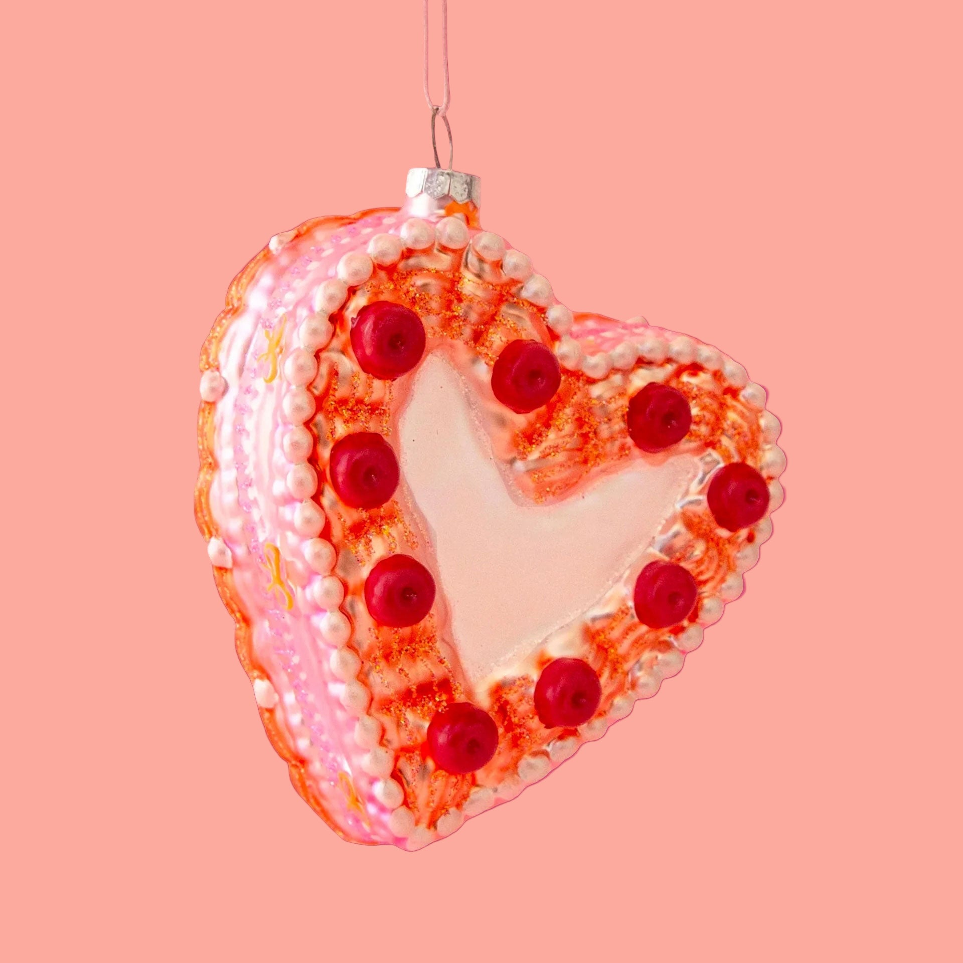 A vintage heart shaped cake ornament.