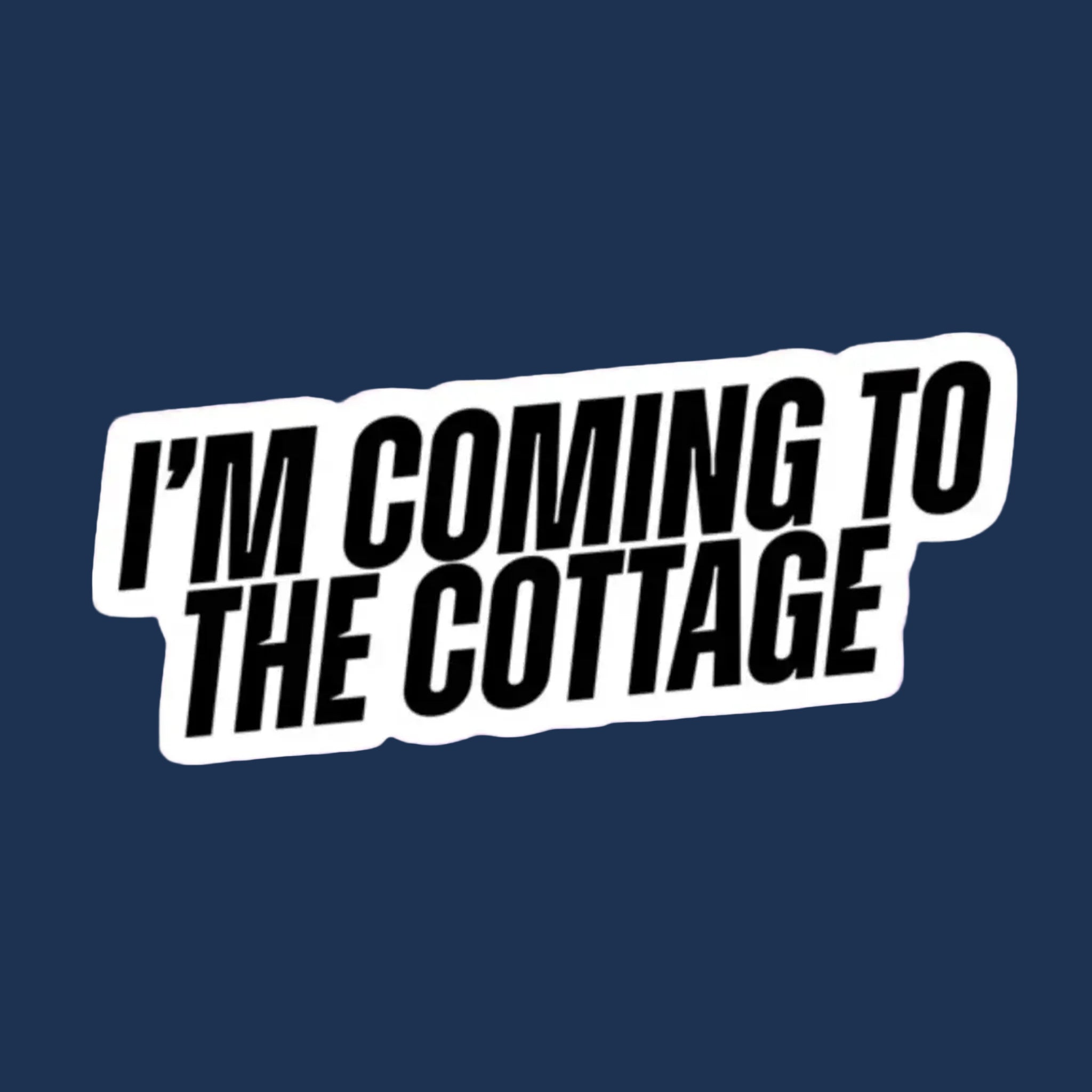 A sticker that reads, "I'm Coming To The Cottage". 