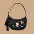 A black crescent bag with a Hello Kitty western embroidered print. 