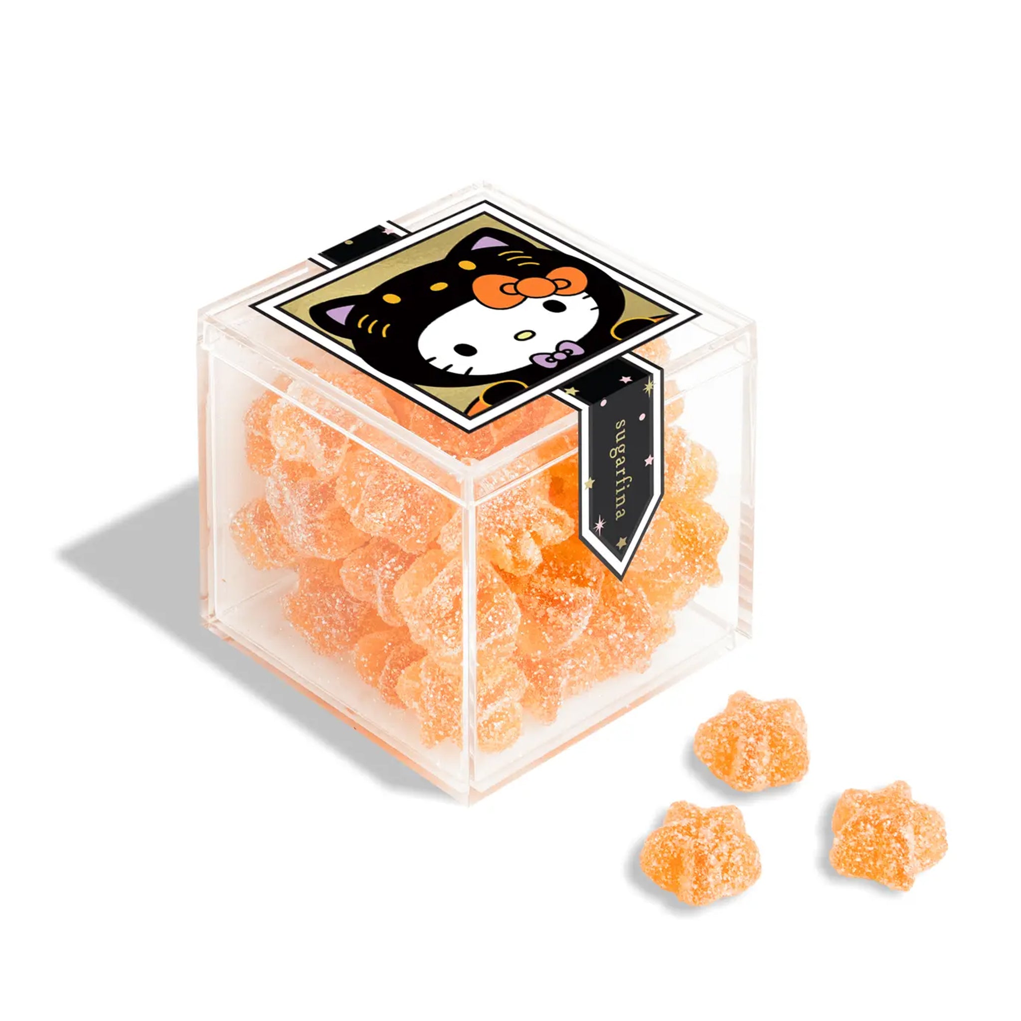 A clear acrylic box of sour star gummy candies with a Hello Kitty Halloween design on the outside. 