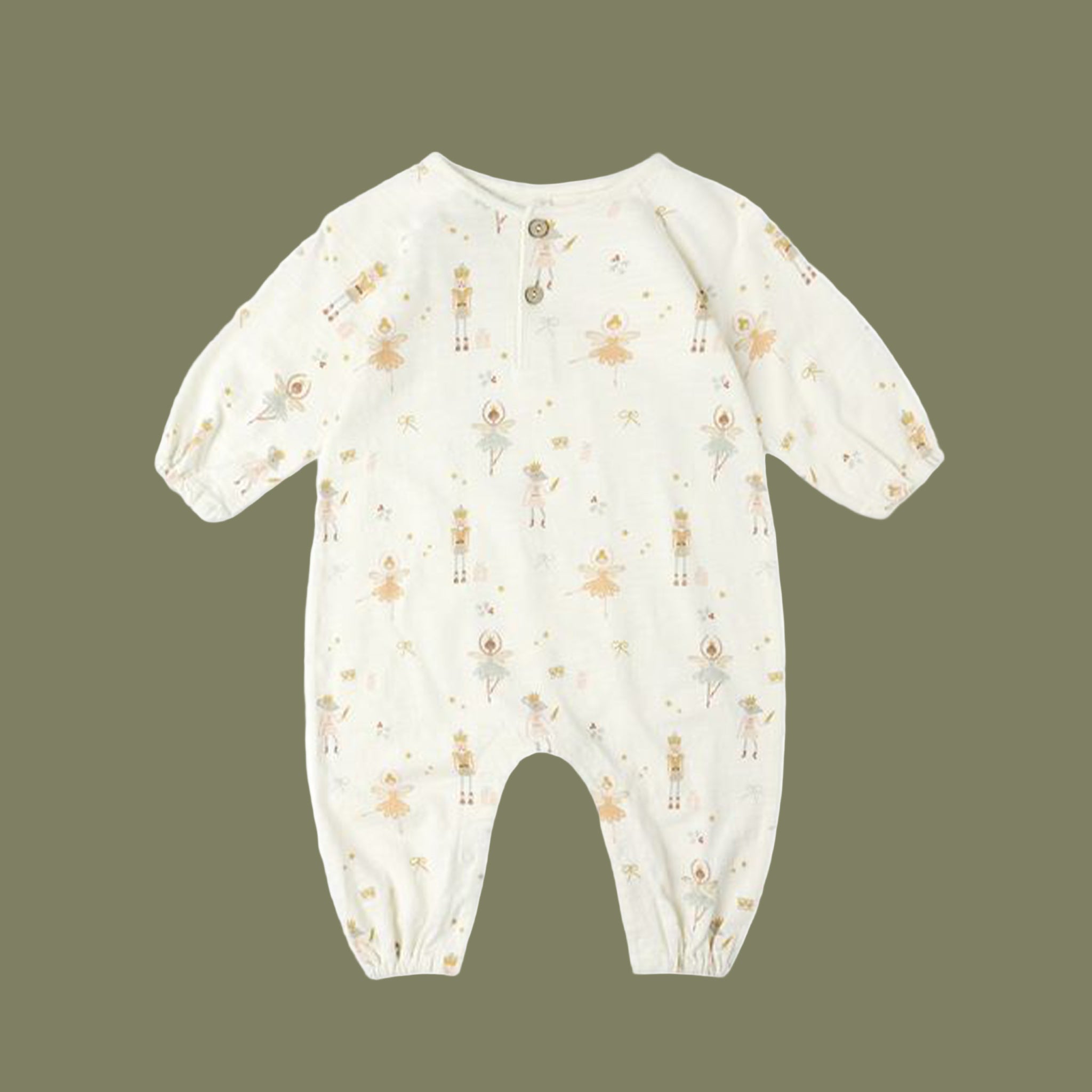 An ivory long sleeve jumpsuit with holiday nutcracker print. 