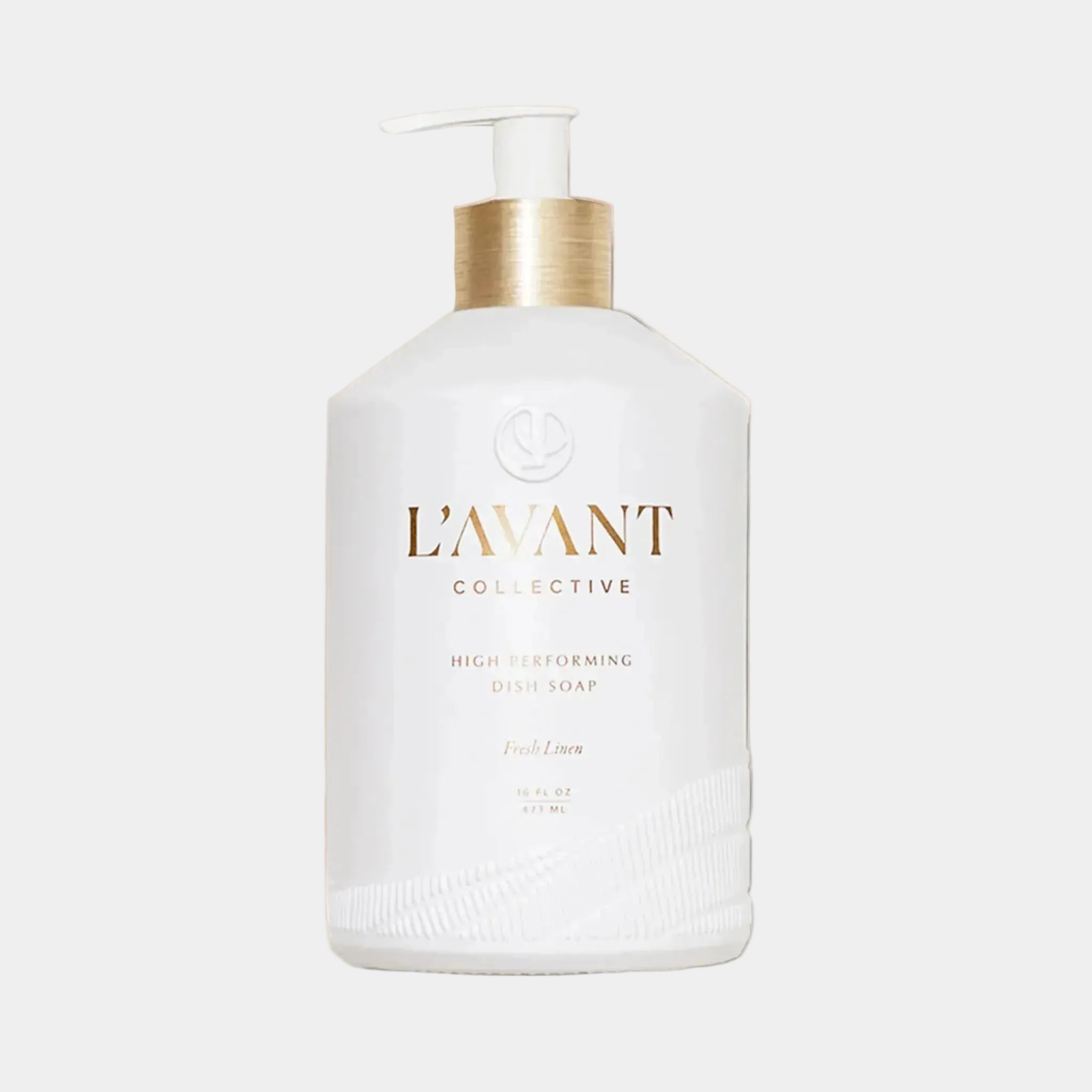 A white bottle of dish soap "L'avant Collective High Performing Dish Soap". 