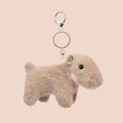 A mini hippo shaped stuffed toy on a keychain.