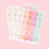 On a pink background is three sheets of gift labels with shades of pink, orange, mint and ivory along with holographic text and designs.