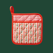 A red pot holder with a red and white holiday design. 