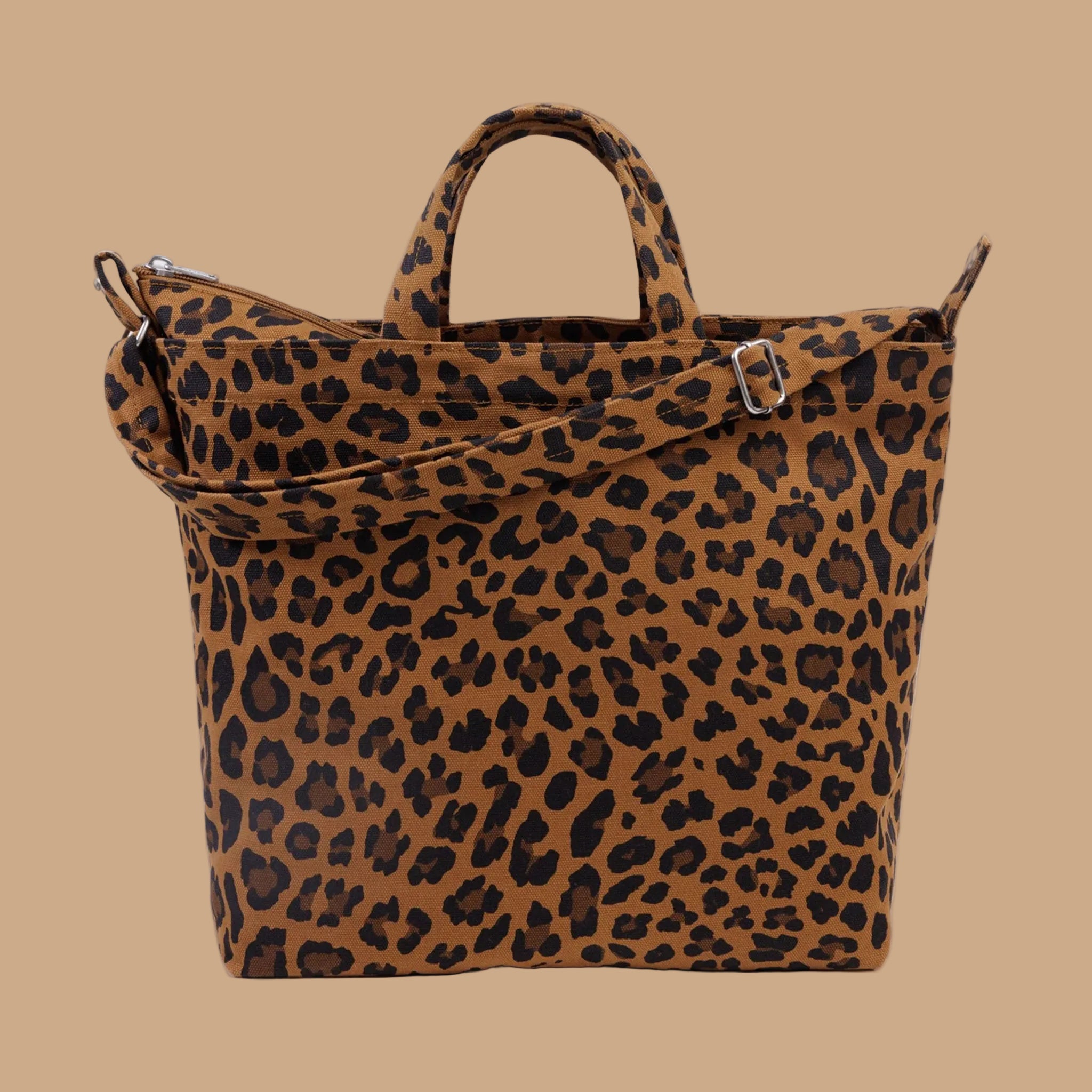 A brown and black leopard print cavas tote bag. 
