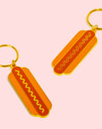 A hot dog shaped keychain with two sides. One keychain per purchase. 