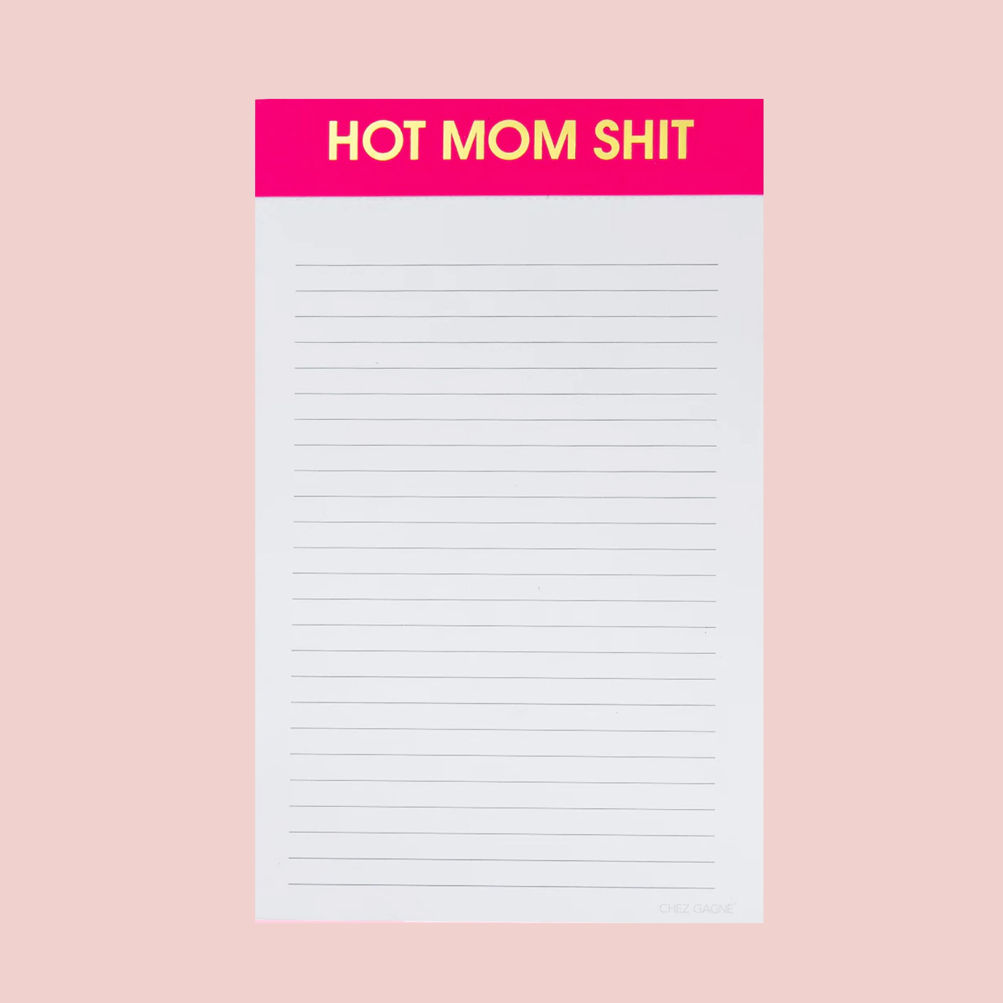 A white and hot pink notepad with gold foiled text at the top that reads, "Hot Mom Shit". 
