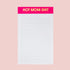 A white and hot pink notepad with gold foiled text at the top that reads, "Hot Mom Shit". 