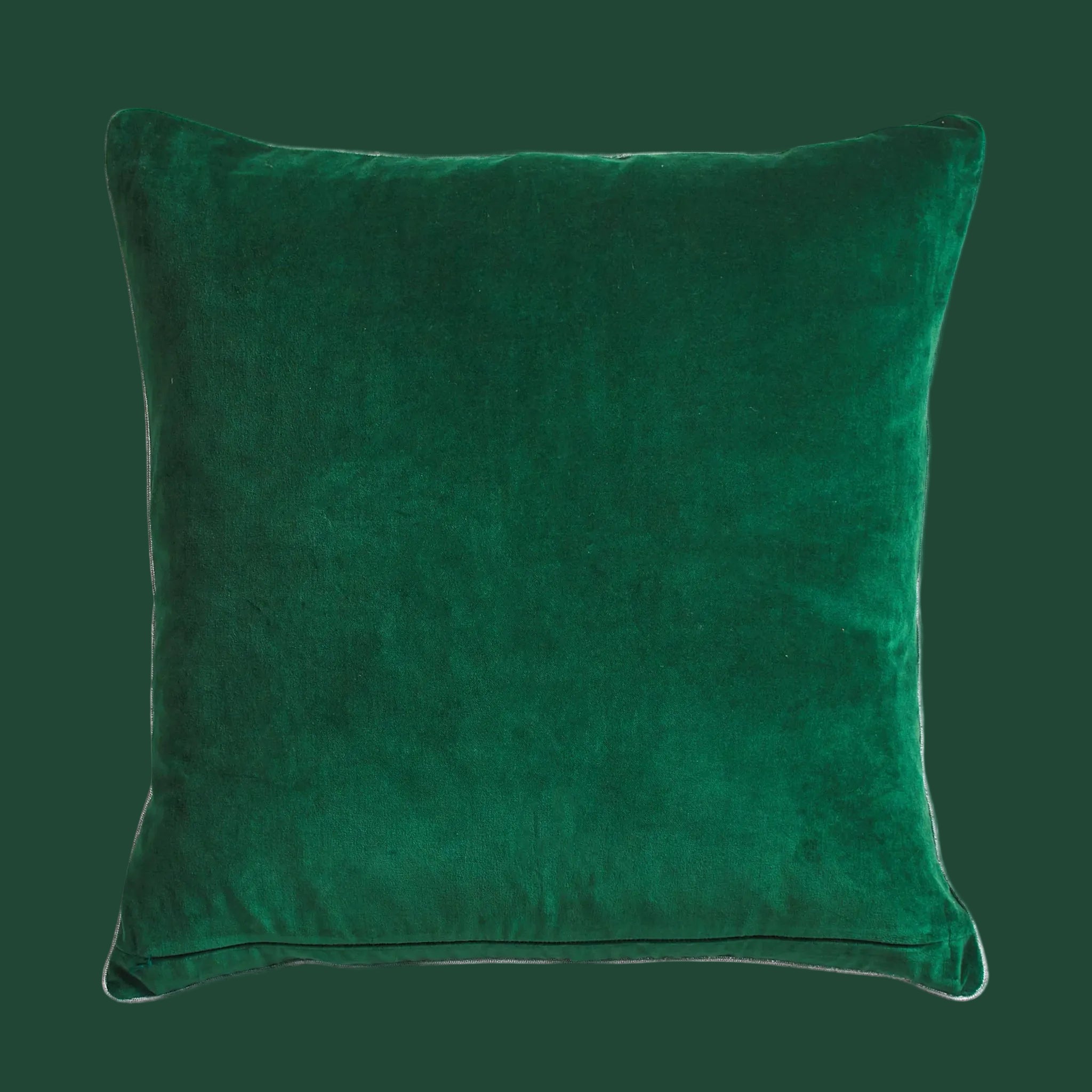 Green velvet pillow on a white background