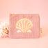 A light pink corduroy pouch with a zipper closure and an orange shell embroidered design in the center. 