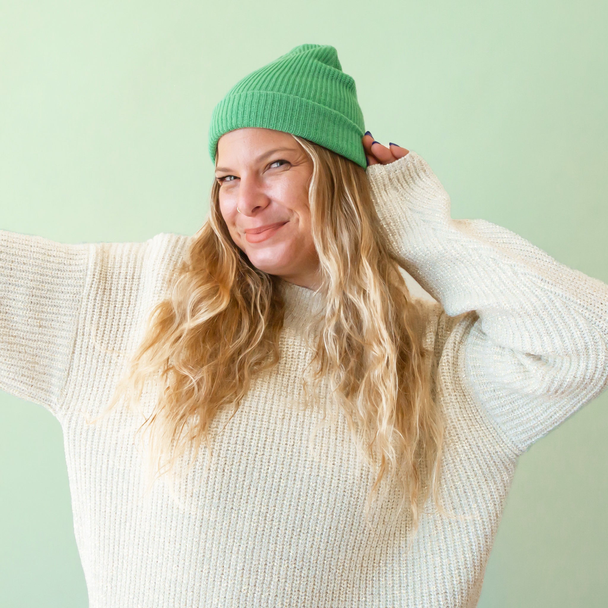  A jade green colored ribbed beanie. 