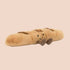 A baguette shaped stuffed toy with an adorable smiling face and brown corduroy feet. 