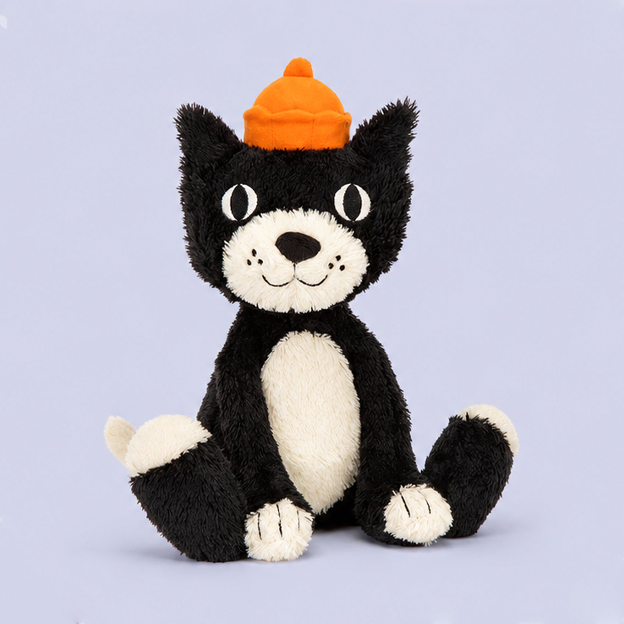 A black and white Jellycat toy. 