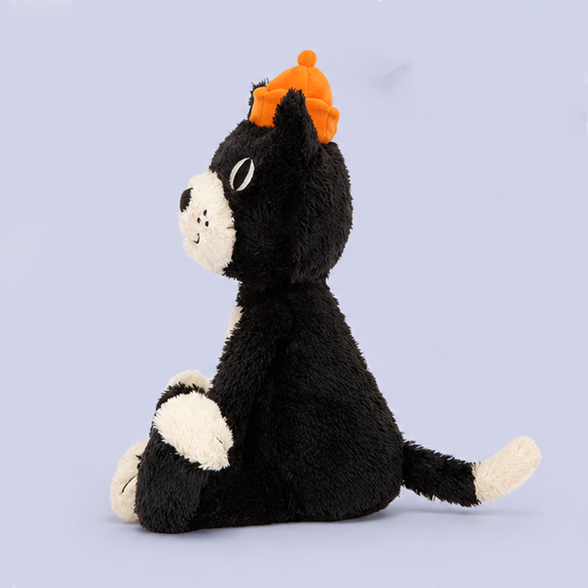 A black and white Jellycat toy. 