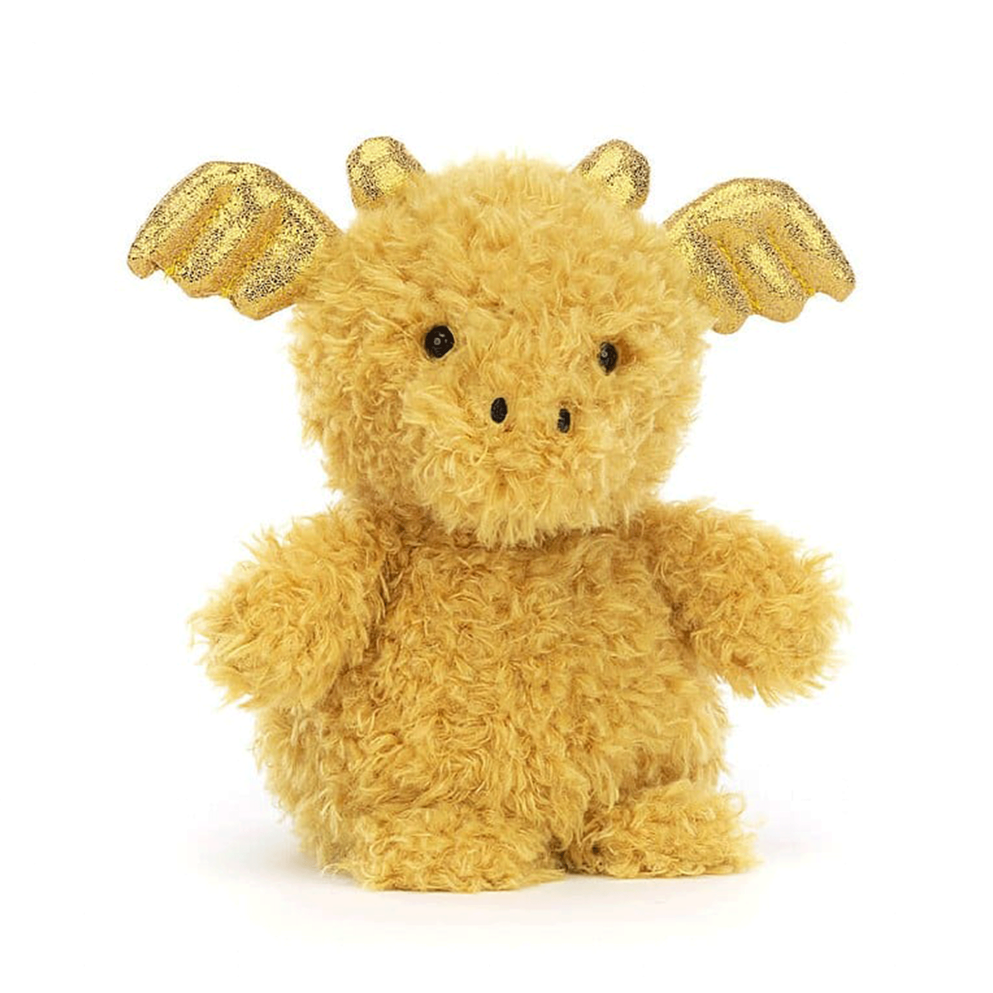 On a white background is a fuzzy yellow dragon shaped stuffed animal with gold wing horns. 