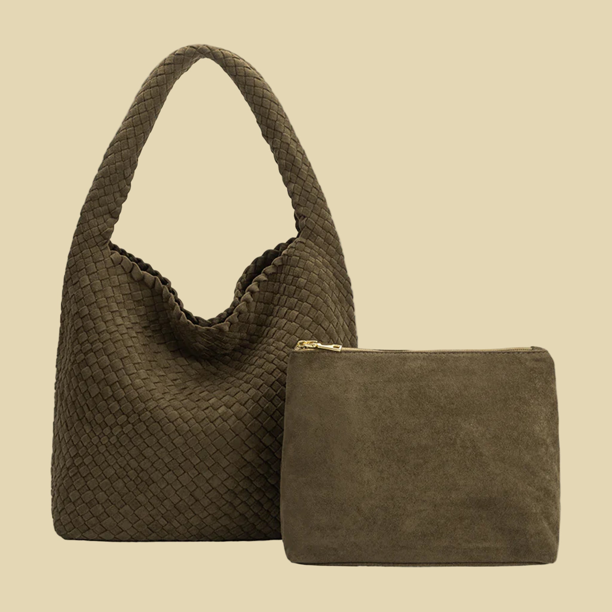 A dark green suede woven handbag with a  zipper pouch insert. 