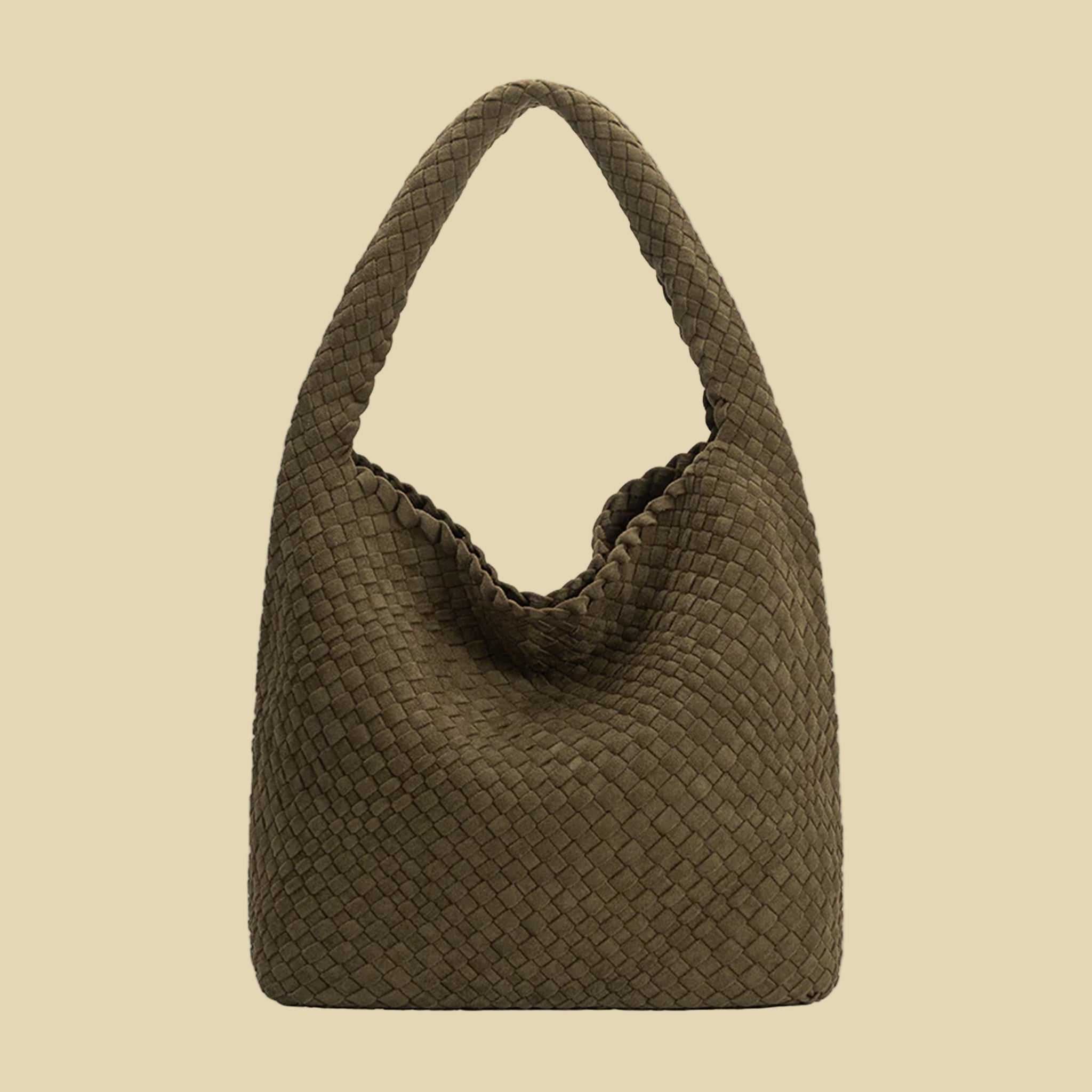 A dark green suede woven handbag with a  zipper pouch insert. 