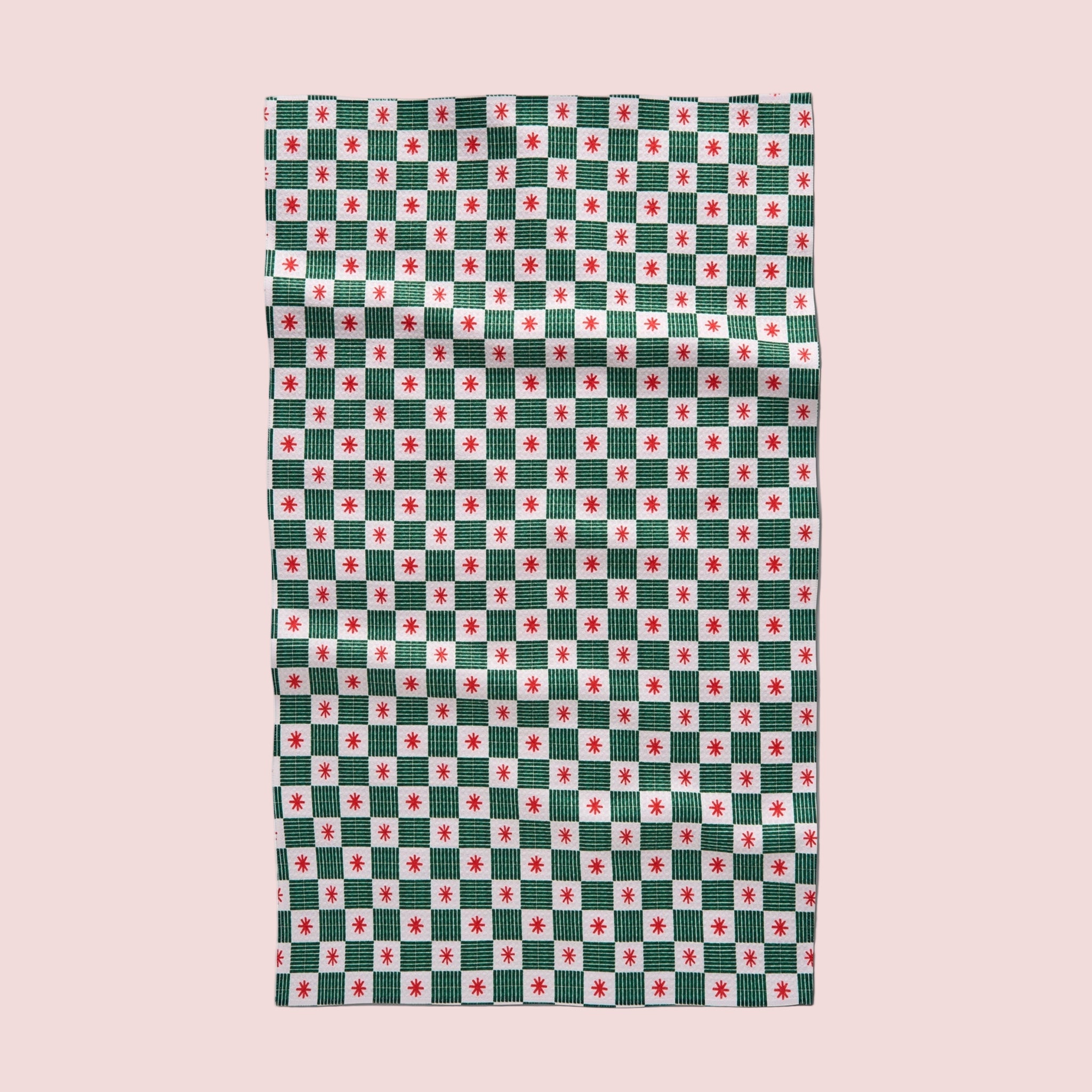 A green, red and white grid pattern kitchen towel. 