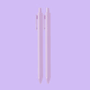 On a purple background is a set of two ballpoint pens with a light purple exterior. 