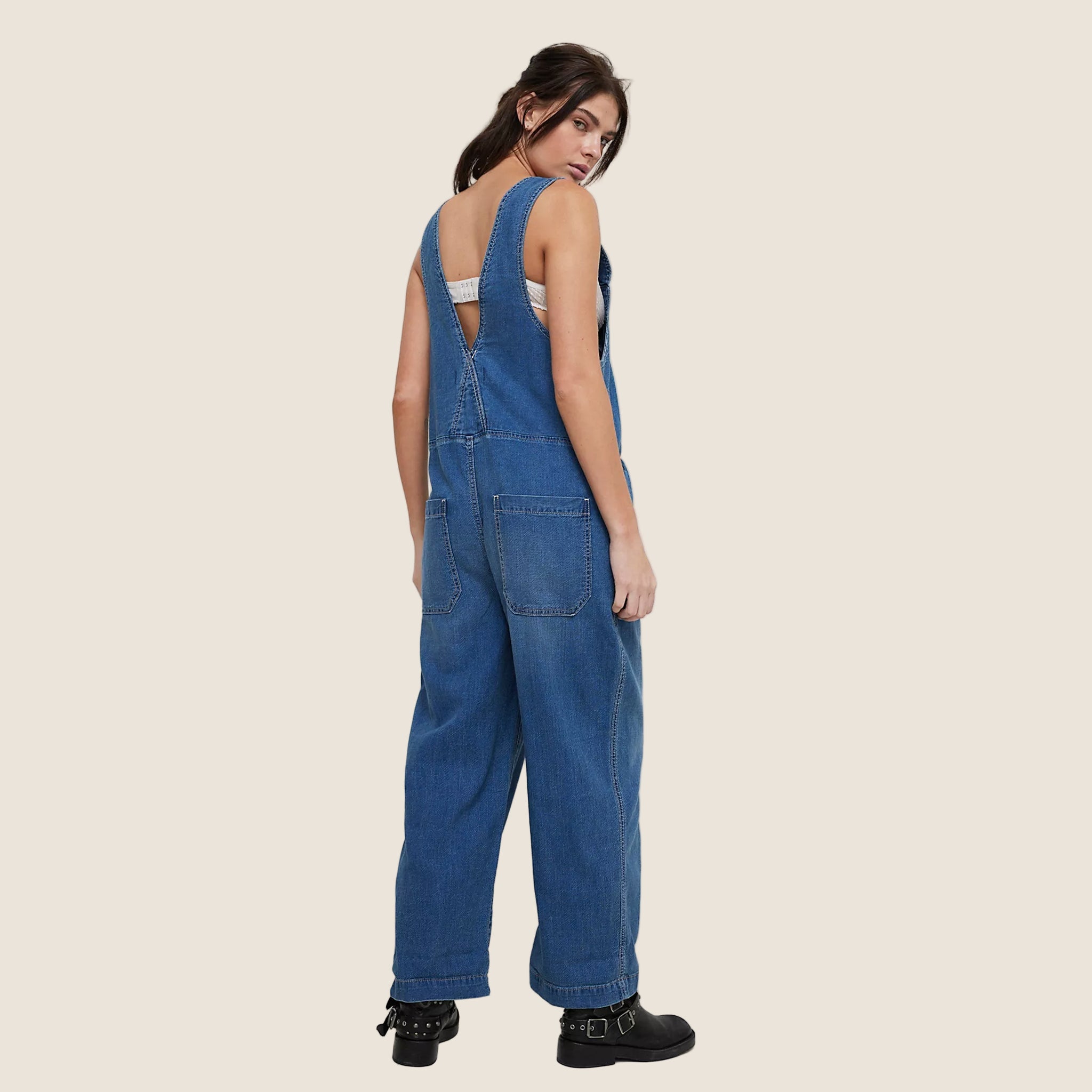 A blue denim jumpsuit overalls. 