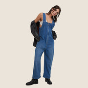 A blue denim jumpsuit overalls. 