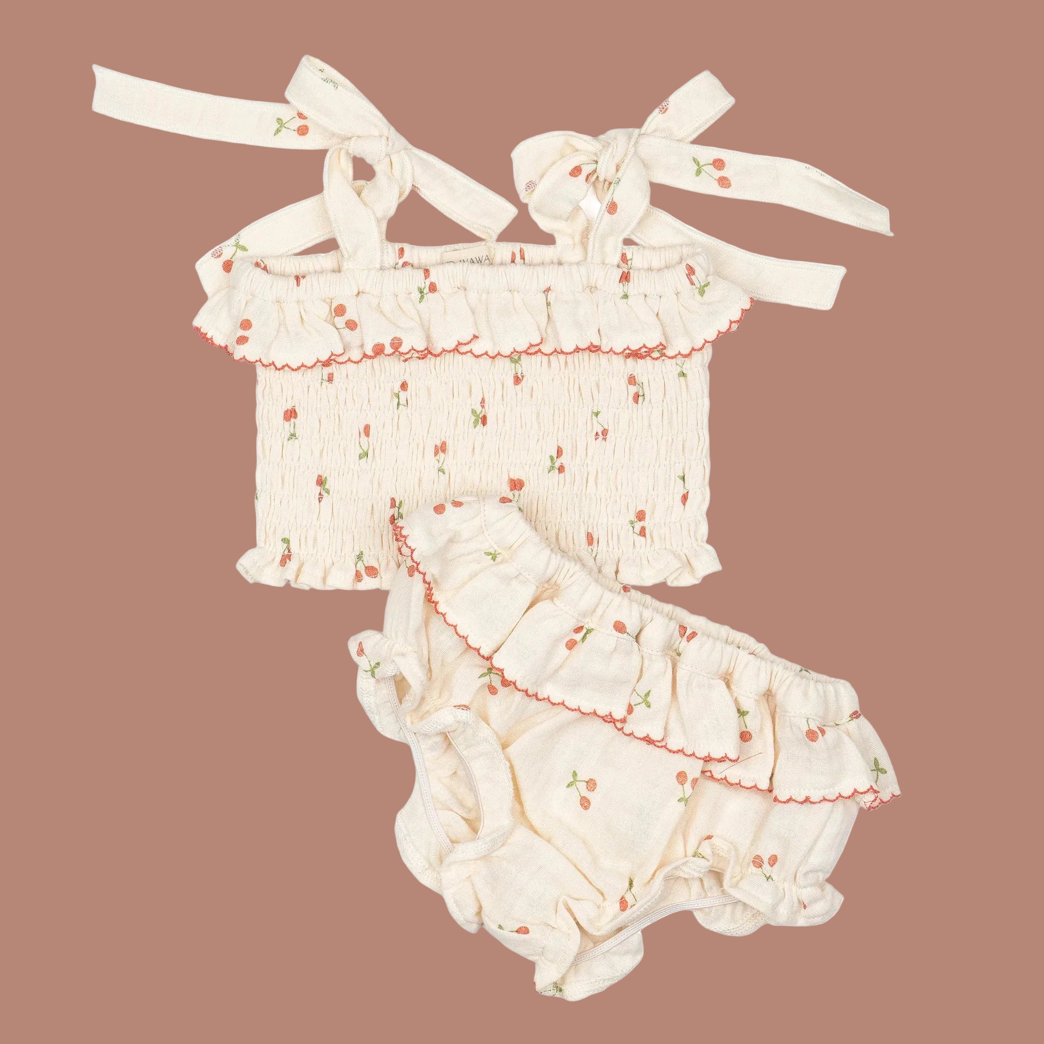 An ivory tank and bloomer set with a cherry print. 