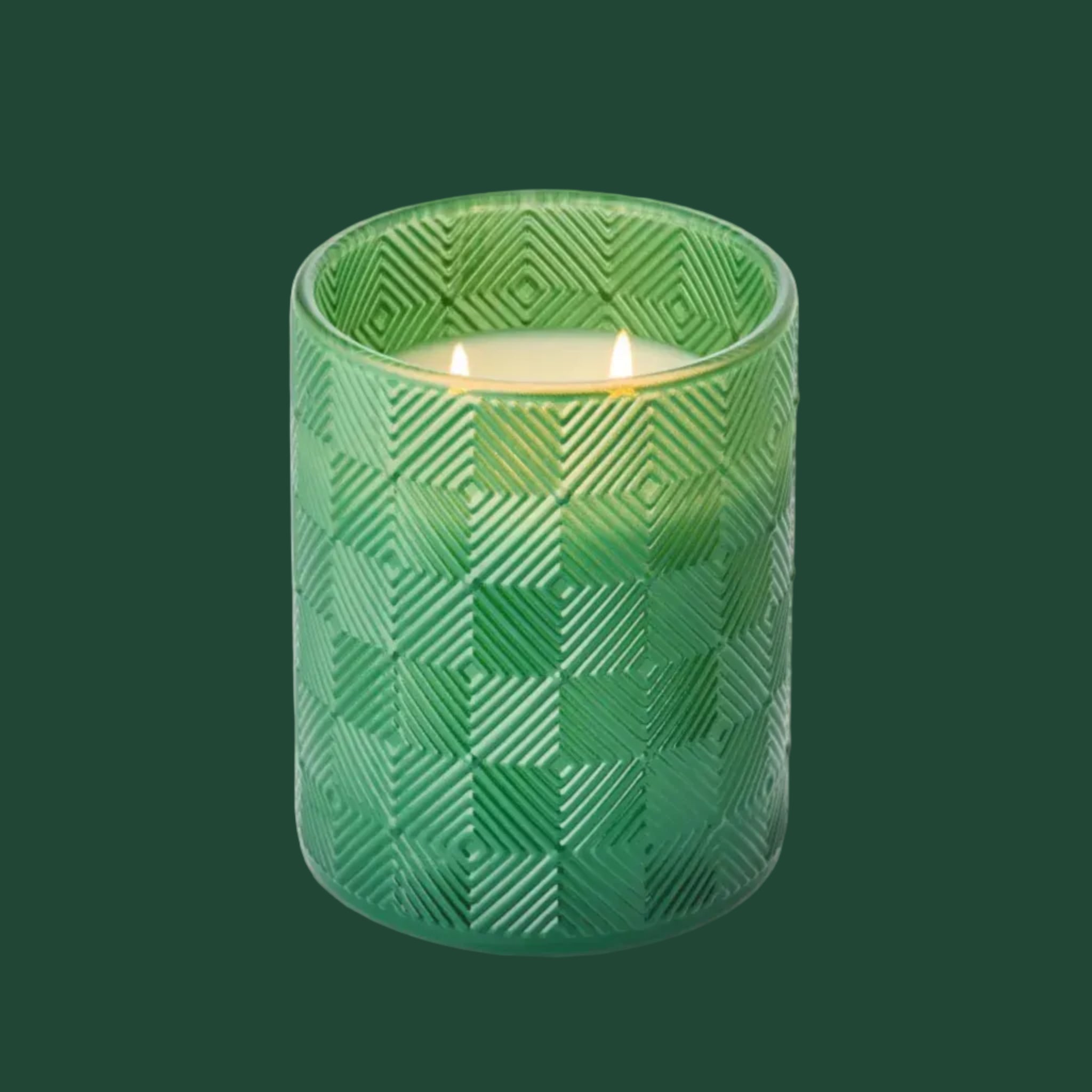A green textured glass jar candle.