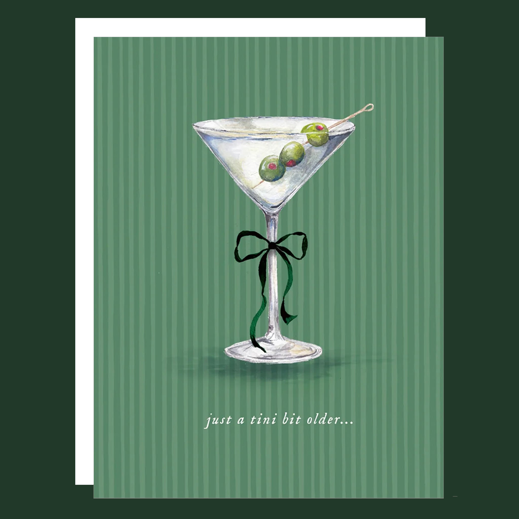 Green striped card with a martini glass,  three olives and a bow on the stem of the glass that reads &#39;just a tini bit older...&#39;