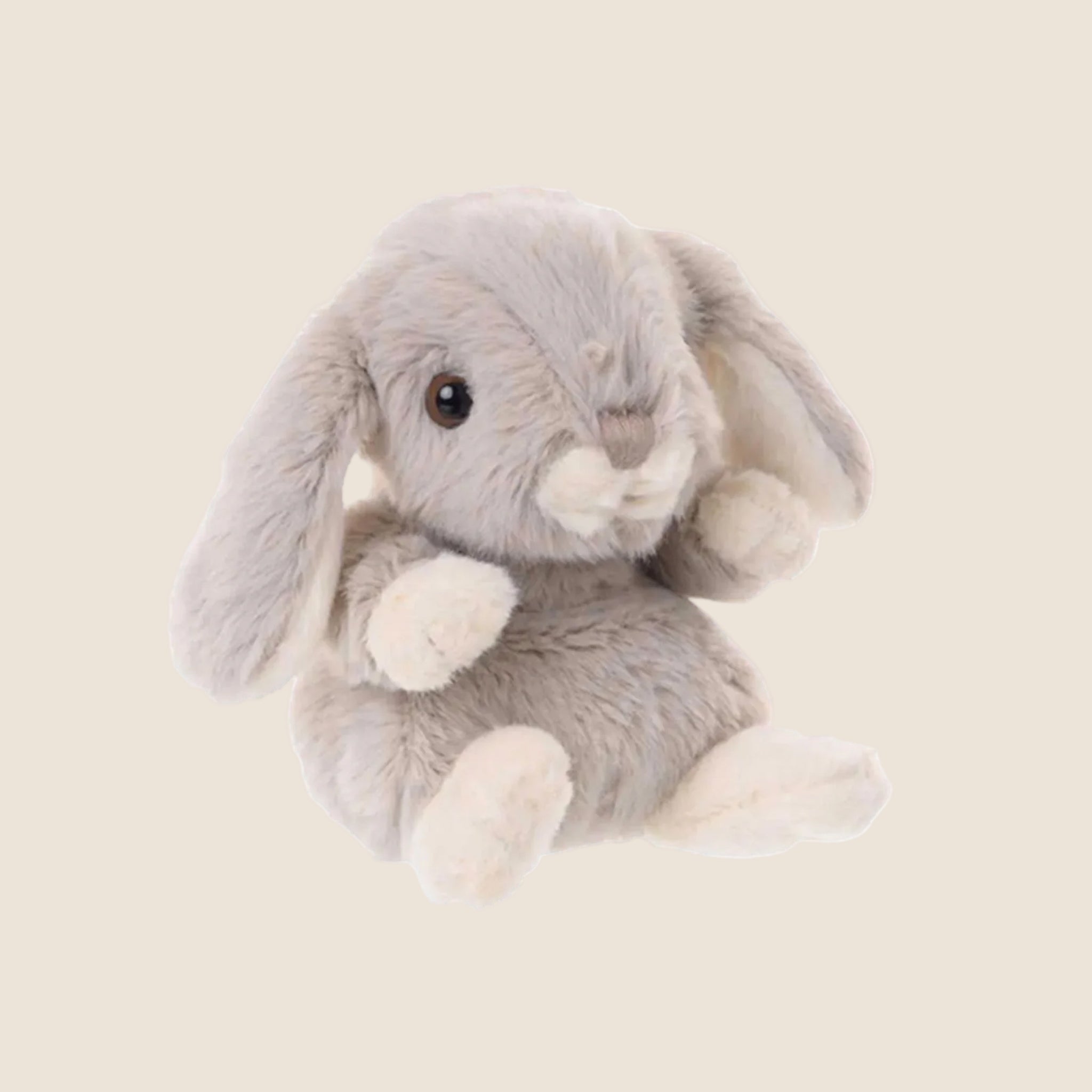 A grey fluffy bunny shaped stuffed animal toy. 