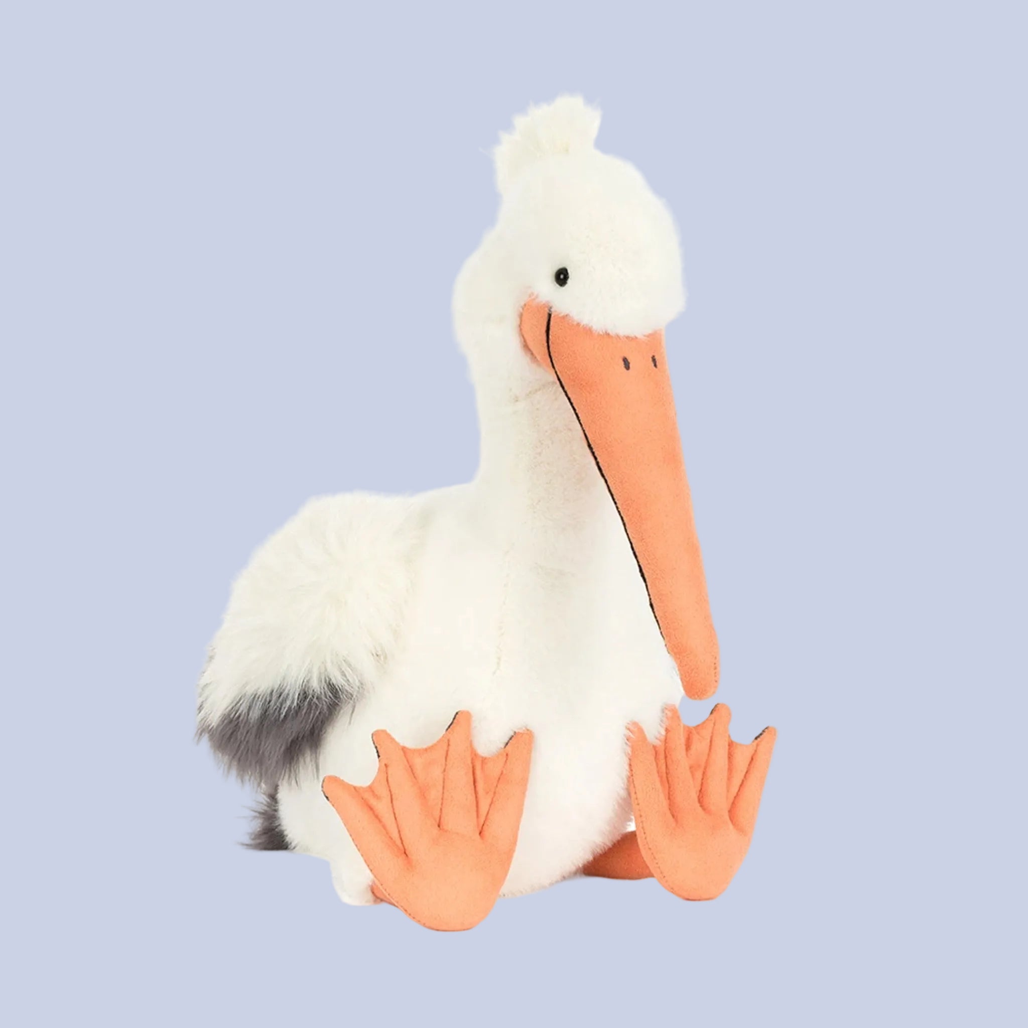 Plush pelican toy with a white body, orange beak, and feet on a white background