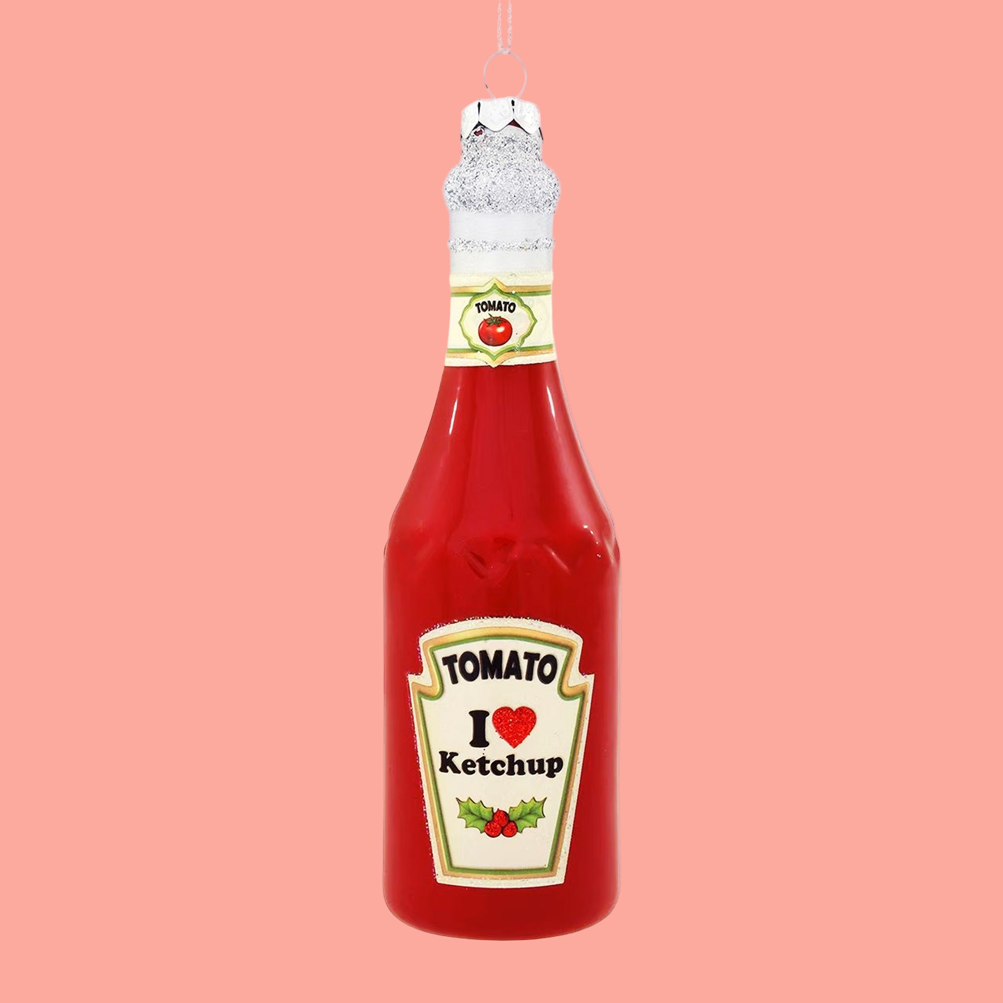 A red bottle of ketchup shaped Christmas tree ornament.  Text on the front of the bottle reads, "Tomato I heart ketchup"