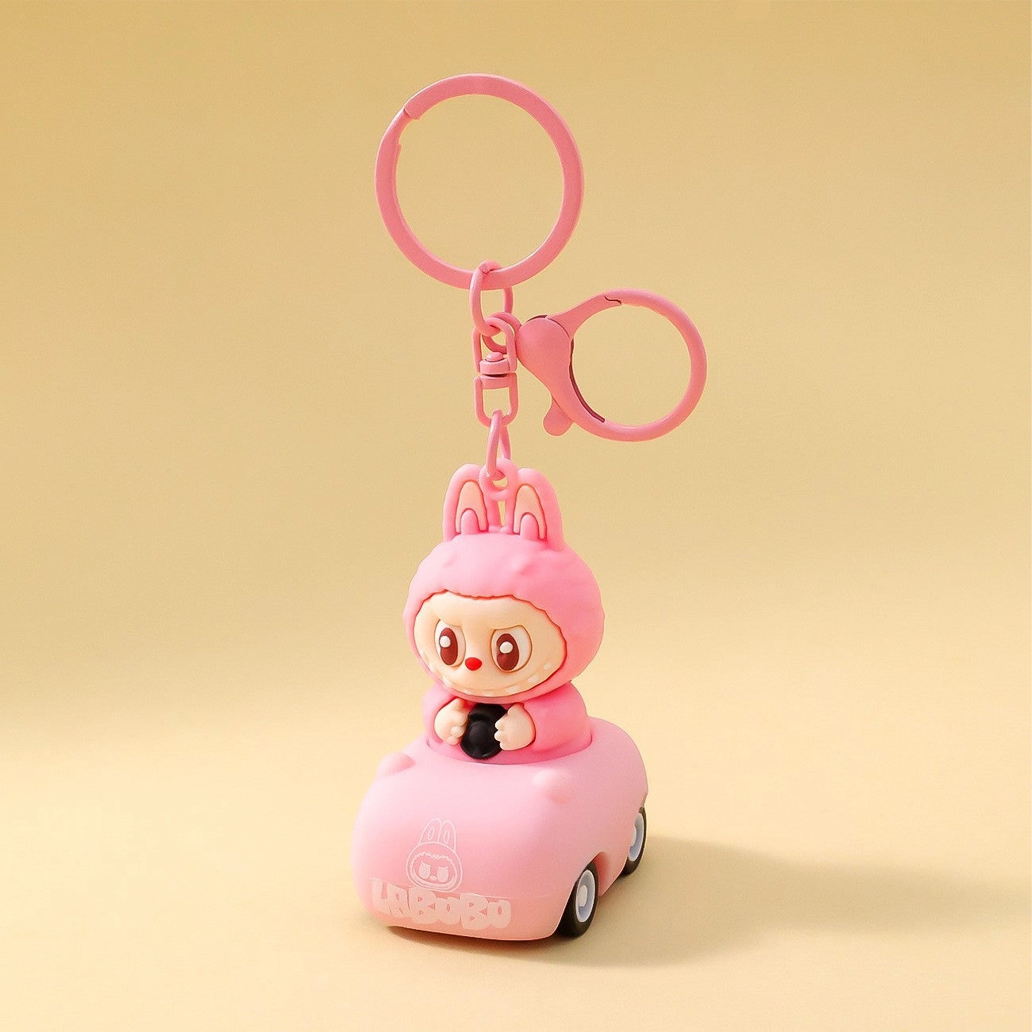 A pink labubu shaped keychain.